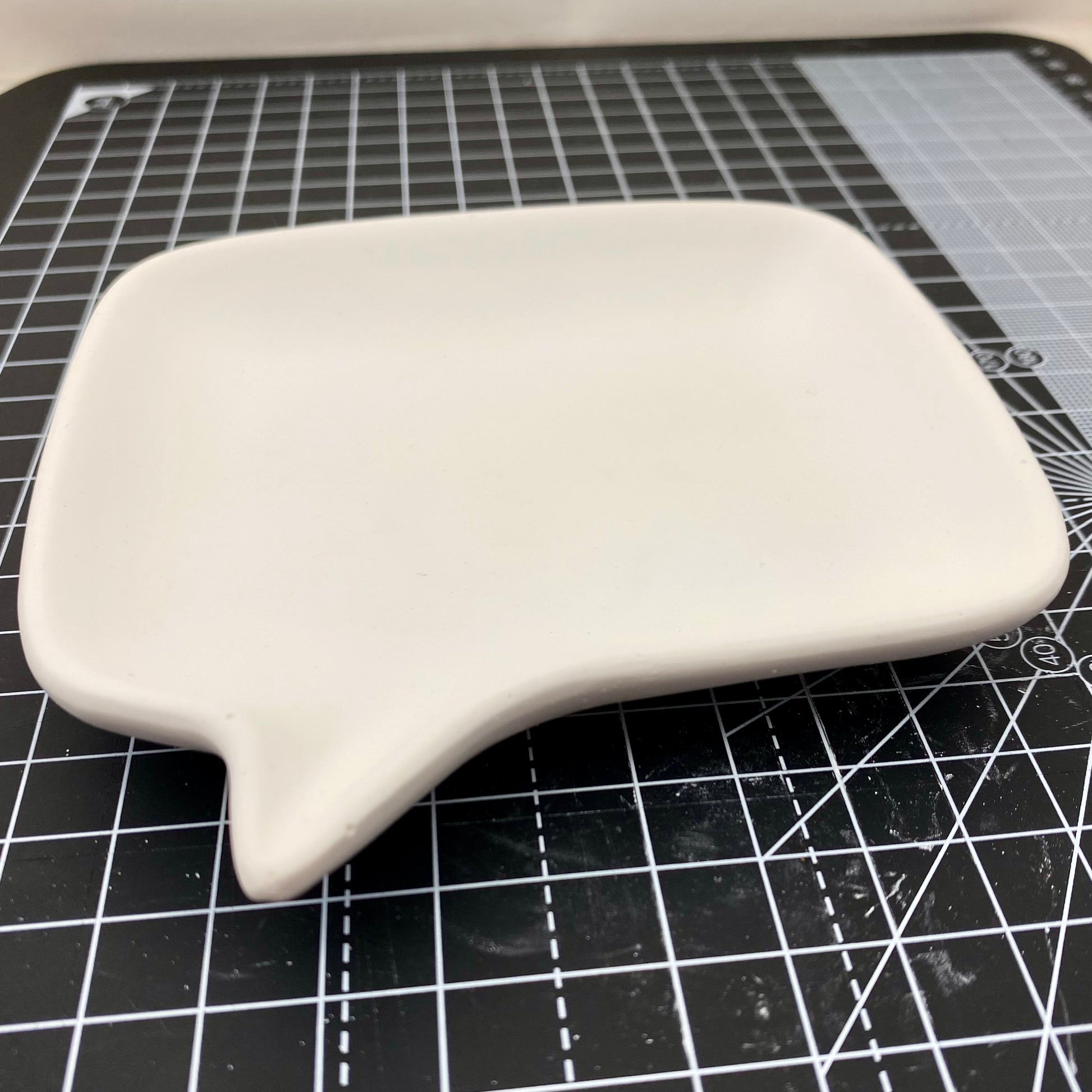 Hand Cast Plaster Speech Bubble Trinket Tray ready to paint. Side view.