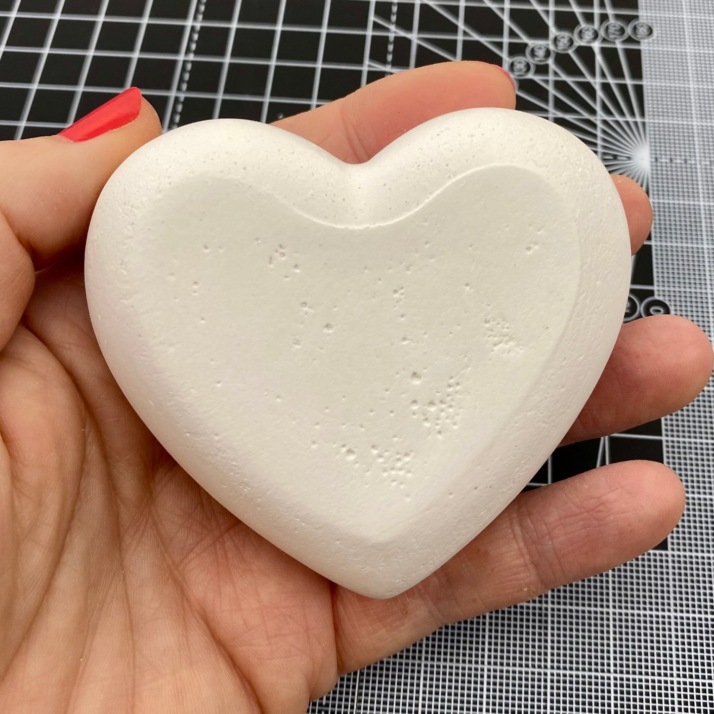Hand Cast Plaster Heart Stone ready to paint. Bottom view.