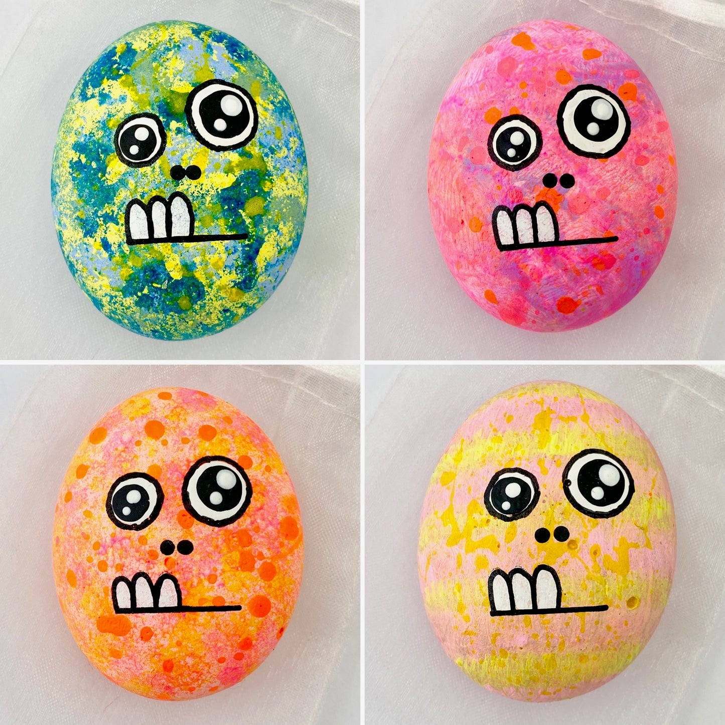 Hand painted 2 eyed monster pebbles called Flomp in 4 different colour ways