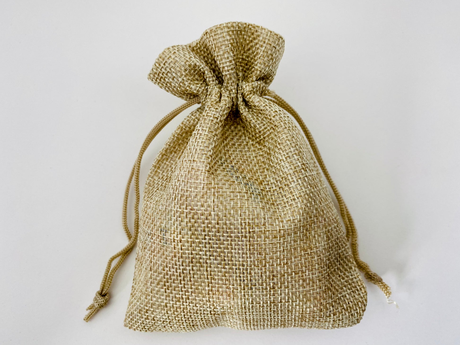 A hessian bag with pebbles inside