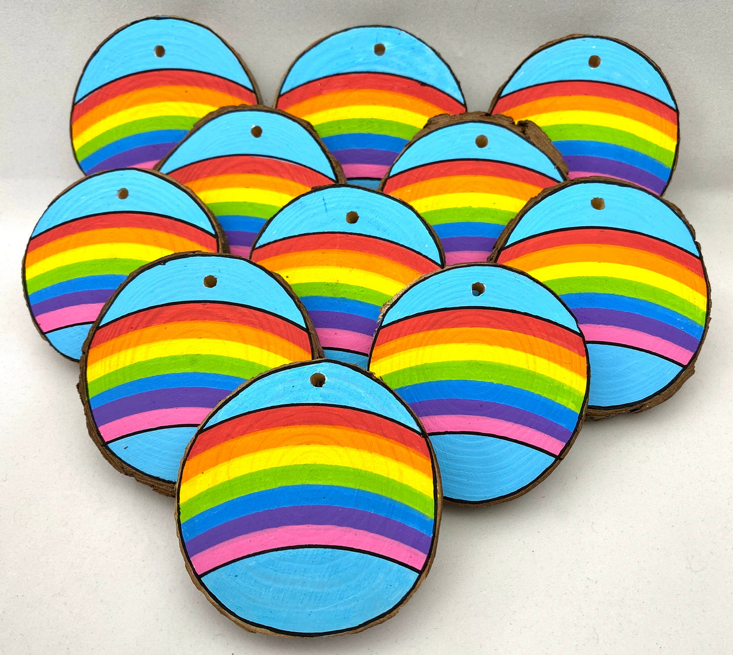 Lots of Hand painted Wooden Slices with Rainbows on