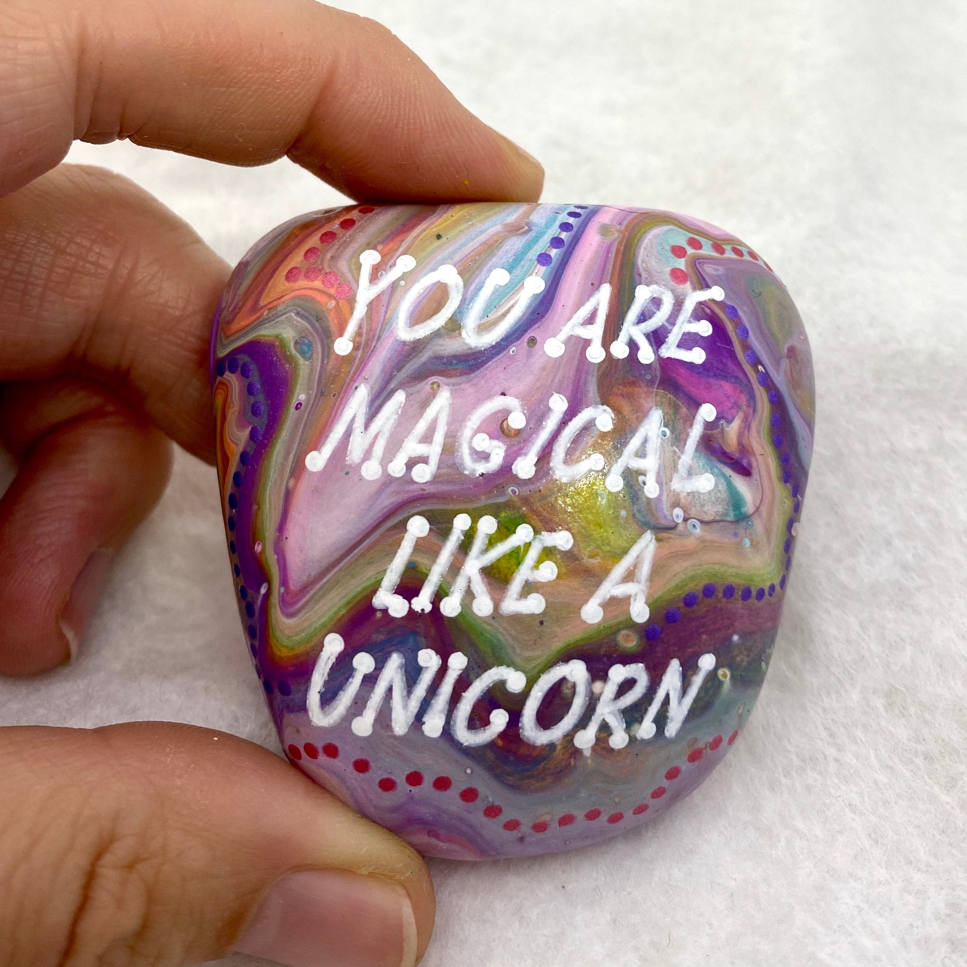 Colourful Hand painted Stone with the words You are Magical Like a Unicorn