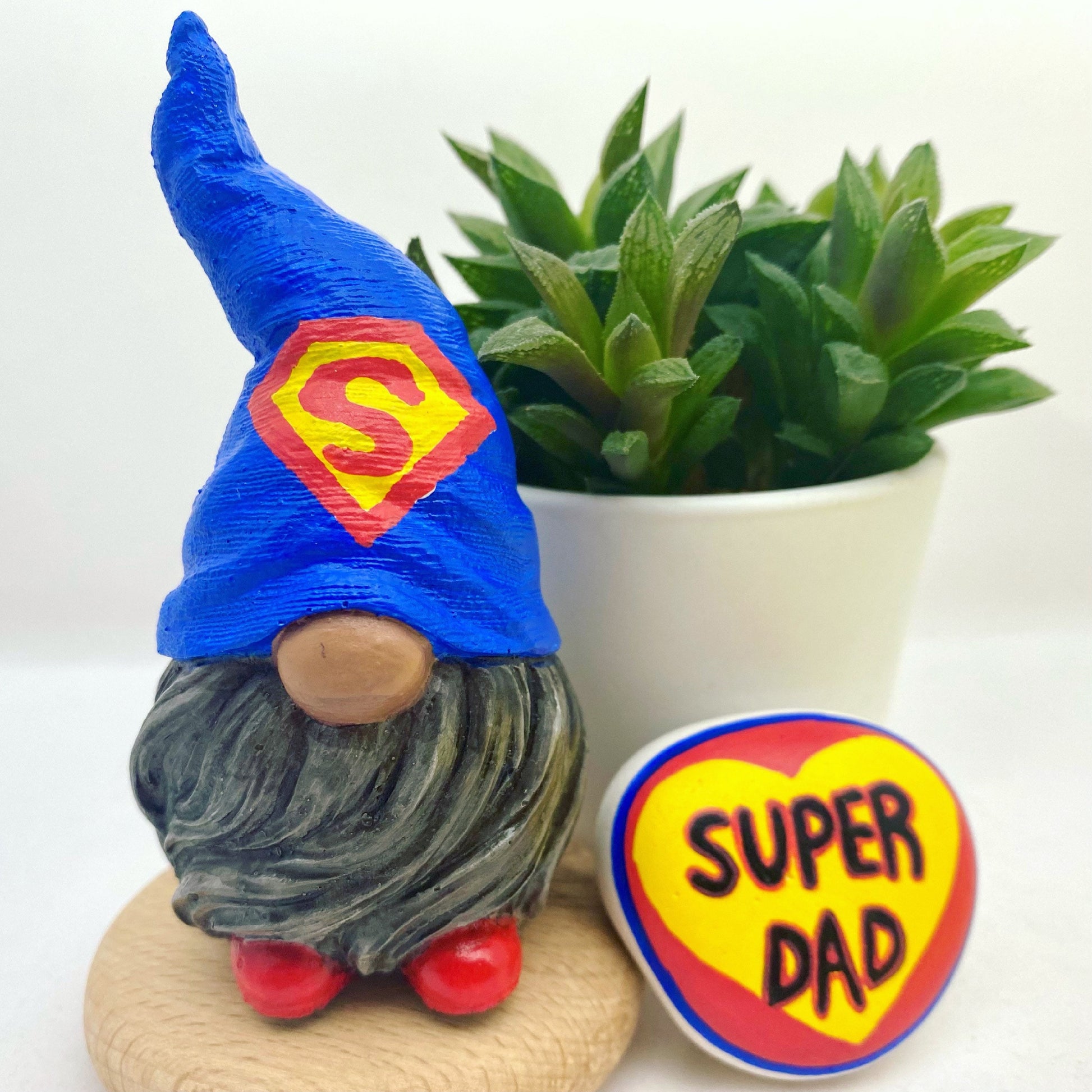 Hand painted Gonk statue with Superman hat and Super Dad stone