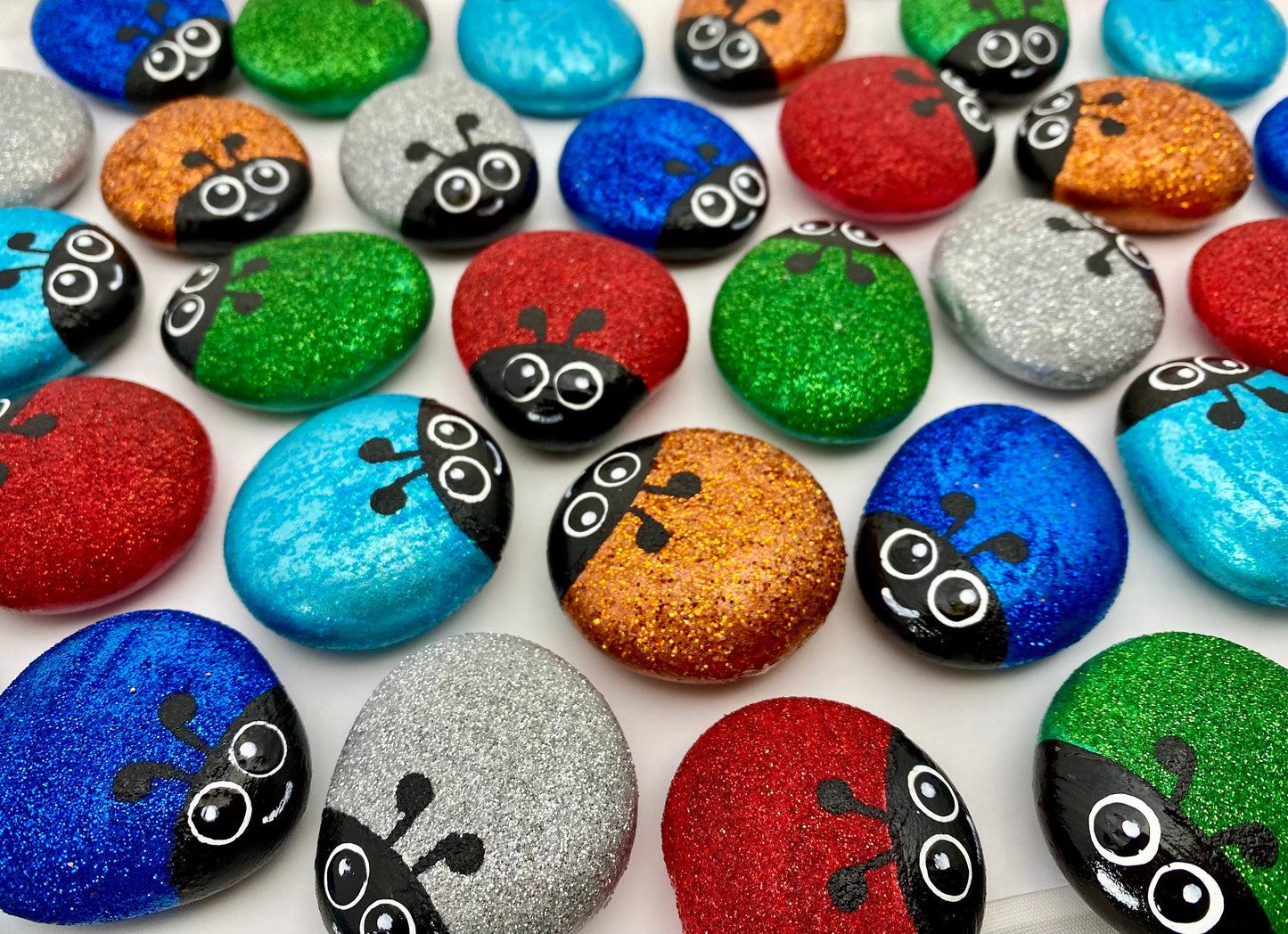 Lots of Hand painted Glitter Bug Pebbles in Red, Green, Blue, Dark Blue, Silver and Gold