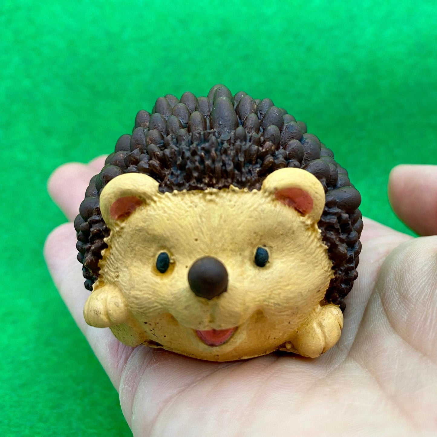 Hand painted Hedgehog ornament held in a hand