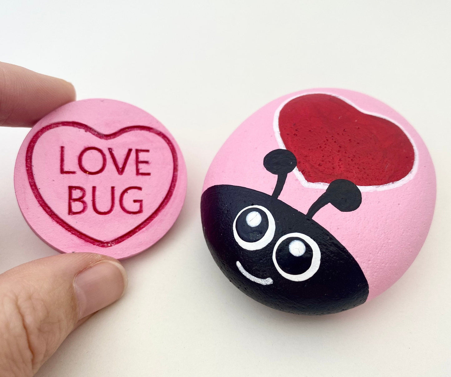 Hand painted Pastel Pink Heart Bug Pebble and Token with the words Love Bug inscribed on